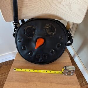 Love, Pain, and Stitches Coal Snowman Face Crossbody Bag